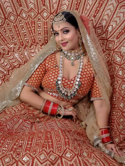A full seated portrait of the bride smiling, exuding joy and radiance.