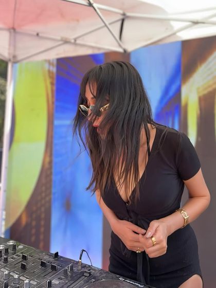 A candid shot of me enjoying a sunny day set. There's no place I'd rather be than behind the decks, sharing music with people.