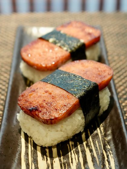Introducing Supamu Nigiri, a playful Okinawan twist on traditional nigiri. Made with seared Spam on seasoned rice and wrapped in nori, it brings together sweet, salty, and savory in every bite. A nostalgic street-food favorite from Japan’s southern islands.