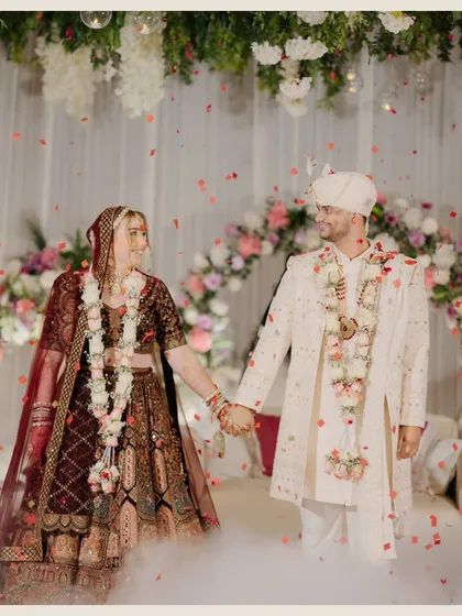 Hand in hand, they walk through a cloud of smoke, ready to begin their life together. This shot captures the dreamy, fairytale quality of their wedding ceremony.