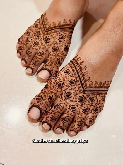 Another angle of the engagement foot mehendi, showing the delicate and clean line work.