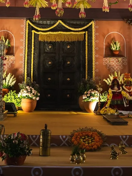 A closer look at the intricate details of the naming ceremony stage. We included elements like Kondapalli toys, brass vessels, and a vintage gramophone to perfectly capture the 1990s village aesthetic.