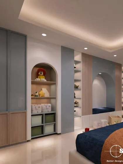 This view of the kid's bedroom highlights the smart storage solutions we integrated. It includes arched niches for toys and books, along with sleek, dual-toned wardrobes.