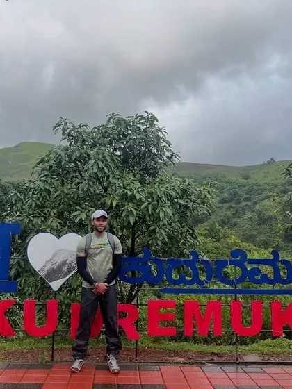 Posing at the iconic "I Love Kudremukh" sign. It's a must-do photo stop for everyone who visits.