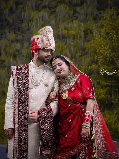 A tender moment where the bride rests her head on the groom's shoulder. These quiet, intimate shots are a beautiful part of any couple's photoshoot.