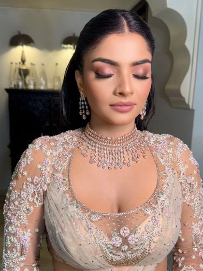 A final portrait of the bride, showcasing her flawless makeup and Hollywood waves.