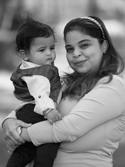 A black and white version of a mother and child portrait, highlighting the textures and expressions without the distraction of color.