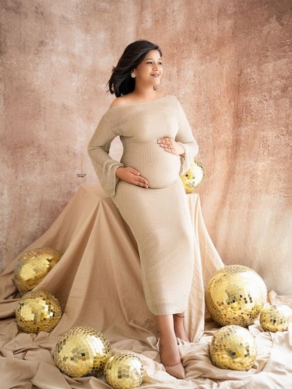 A fun and glamorous shot with golden disco balls. This adds a touch of party-ready sparkle to the neutral, earthy-toned setup.