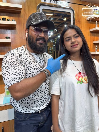 Our artist Nadeem with a client after her new lip piercing. We love seeing our clients happy with their new look.