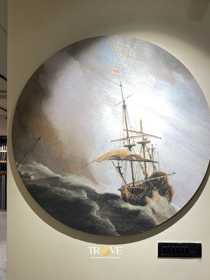 This circular tile mural, depicting a classic ship on a stormy sea, demonstrates the versatility of my custom production. I can create bespoke tile art in any shape or style, turning a simple wall into a sophisticated and dramatic focal point for your living area or study.