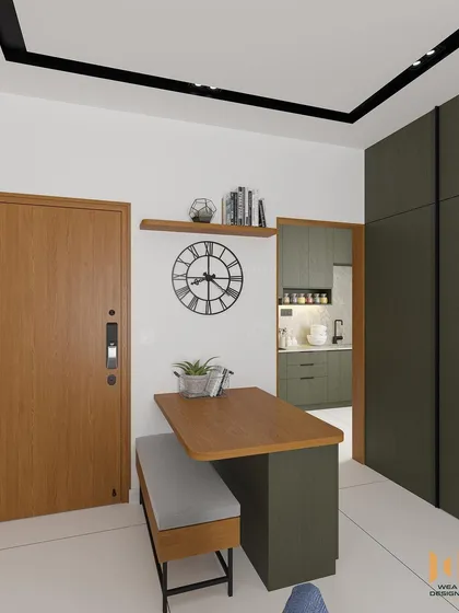 The entrance of the Nano Home, featuring a foldable dining table with bench seating to maximize space.