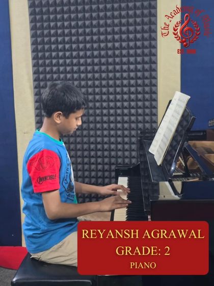 Reyansh Agrawal sits at the piano for a final practice session. This focused time in our sound-treated room is crucial for building confidence before the Grade 2 Trinity exam.