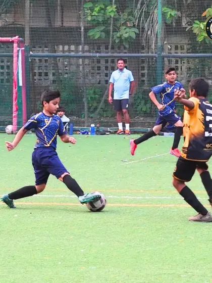 A player lines up a shot on goal during a match against Mumbra FA. We encourage our players to be decisive and confident in the attacking third of the pitch.