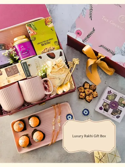 This Luxury Rakhi Gift Box is designed for the sibling who appreciates the finer things. It includes a mix of sweet treats like motichoor ladoo and pistachio brittle, paired with elegant ceramic mugs and a keepsake tray. It’s a modern, aesthetic take on a timeless tradition.