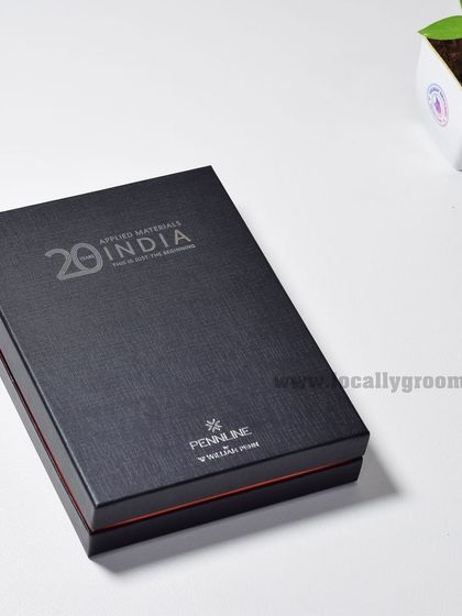 The elegant black gift box for the Applied Materials India 20th anniversary diary. The sophisticated packaging enhances the perceived value of the gift inside.