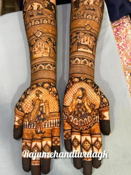 A classic bride and groom portrait design. The figures are clear and detailed, making them the highlight of the full-hand mehendi.