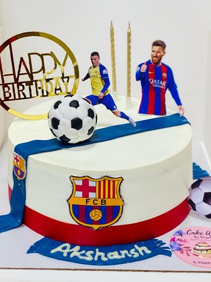 A football-themed cake featuring Messi and Ronaldo, perfect for a sports fan's birthday.