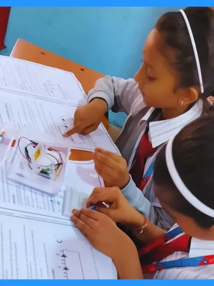 This picture captures the essence of my classroom: collaborative, hands-on learning. Here, two students work together, referencing their guide to connect a circuit. It’s in these moments of focus and teamwork that real understanding begins.