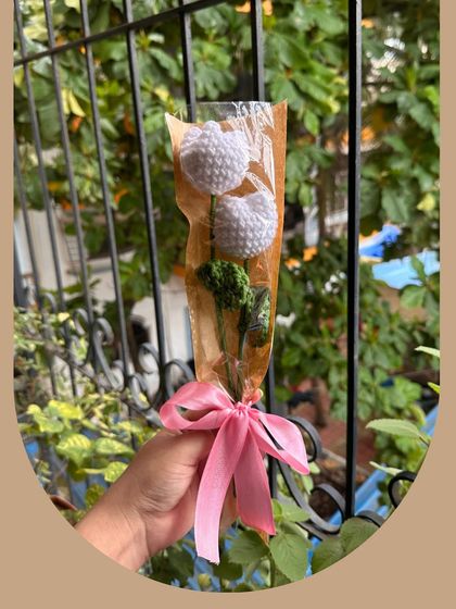 Another look at the "Hugging Tulips" bouquet, a popular choice for a simple, elegant gift. Each tulip is carefully crafted to capture the flower's classic shape, creating a piece of decor that is both minimalist and charming.