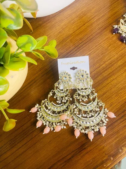 A softer, elegant option in the tiered chandbali style. This pair features light pink beads, making it ideal for daytime weddings or pairing with pastel-colored outfits.