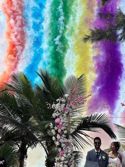 A dramatic and colorful exit with rainbow smoke bombs against the palm trees of Goa. We love creating these unforgettable, Instagram-worthy moments.