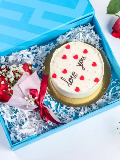 Celebrate love with my special Valentine's Day bento cake gift box. It includes a personal-sized cake and a beautiful bouquet of roses, making it the perfect gift for two.