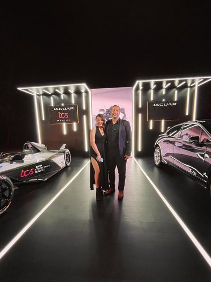 Posing with my band leader between our cars at the Jaguar TCS Racing event. We bring a level of style and energy that matches our clients' brands.