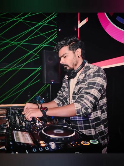 Another angle of me at the console at White Lotus Club. The laser grid creates a cool, futuristic effect that's perfect for my Bollytech sets.