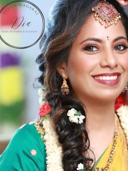 A bright and joyful look for a Haldi ceremony. The makeup is kept fresh and minimal, with a focus on glowing skin and a happy smile. The floral hair accessories and yellow saree complete this perfect pre-wedding celebration style.