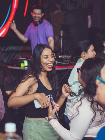 A candid shot of me in the background while a guest enjoys the music up front.