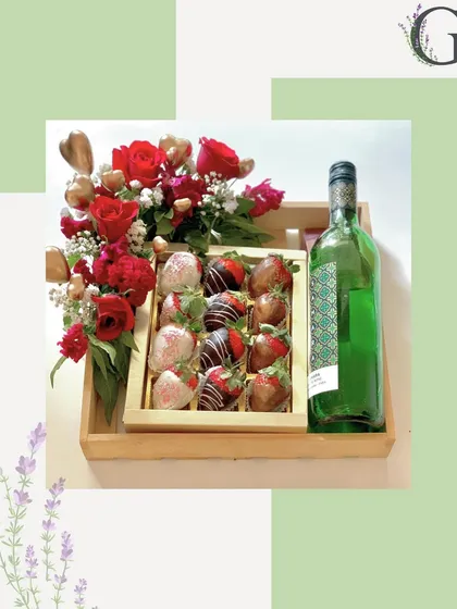 A romantic gift hamper featuring chocolate-covered strawberries, a bottle of non-alcoholic wine, and a bouquet of red roses. Perfect for anniversaries or Valentine's Day.