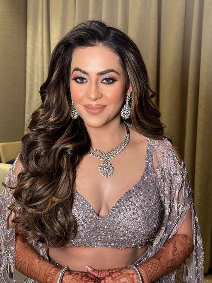 Big, bouncy curls for a glamorous cocktail night in Jaipur. This look is all about volume, texture, and movement, creating a hairstyle that is bold, confident, and ready for the dance floor.