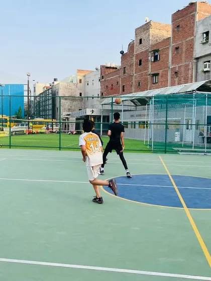 A player leads a fast break, pushing the ball up the court. We encourage a fast-paced, exciting style of play.