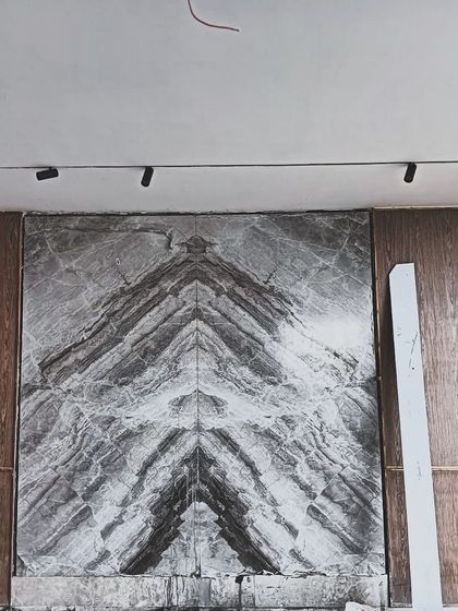 The bookmatched marble wall design is coming up well at our ongoing penthouse project in Noida. Even with the site still under construction, the dramatic veining of the stone makes a powerful statement.