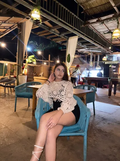 A candid shot at a beach shack in Goa, enjoying the late-night vibes in a crochet top and black skirt.