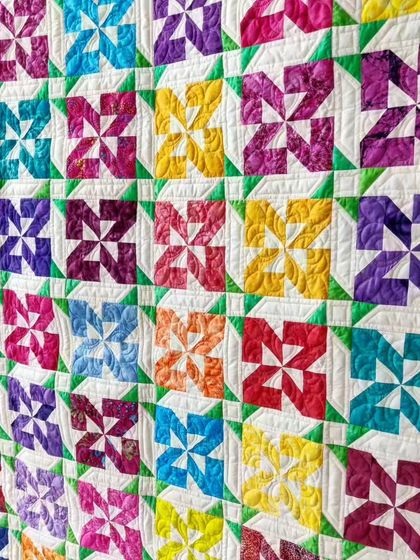 An angled view of the pinwheel quilt.