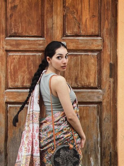 A casual pose in a saree against a rustic door in Pondicherry. This shows how I can create interesting compositions in simple, everyday locations.