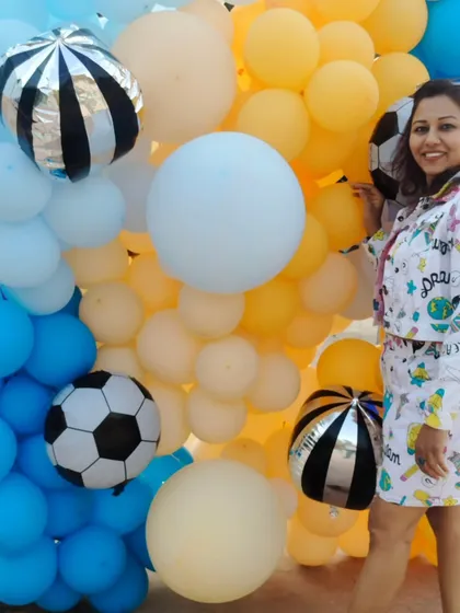 Peace and victory signs at a fun, balloon-filled pool party. The vibe was playful and I dressed to match.