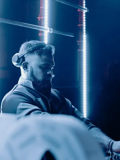A cool, blue-lit portrait from a set at Cavali Skylounge. The lighting gives it a futuristic, sci-fi techno feel.