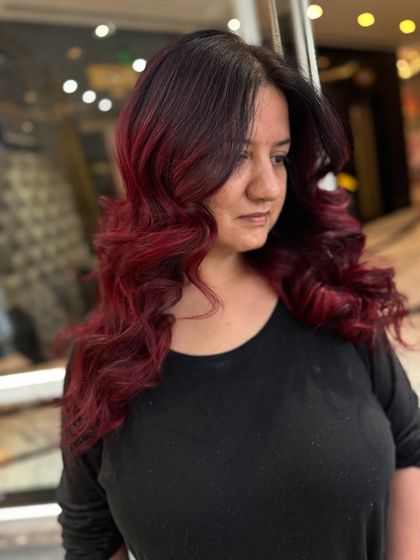 A final look at the stunning red-violet hair, a perfect example of a modern, chic hair color.