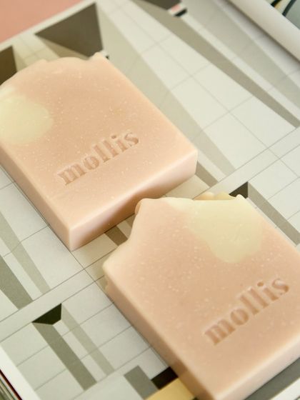 Two Japanese Cherry Blossom bars on a geometric background, highlighting their minimalist beauty.