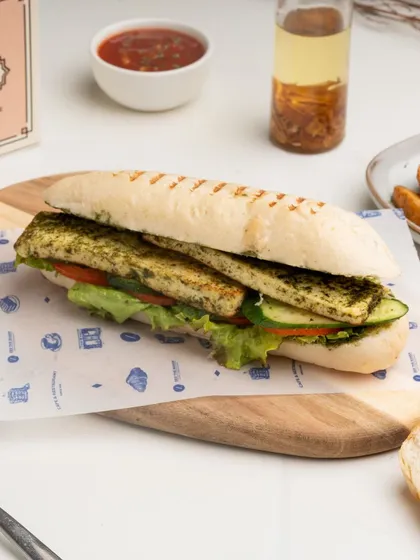 The Grilled Paneer Panini is a fantastic vegetarian option, with thick slices of marinated paneer and fresh vegetables pressed in a classic panini.