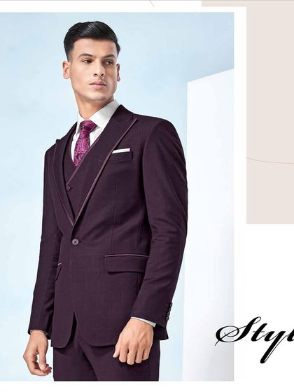 Suits that speak elegance. This deep plum three-piece suit with subtle piping detail is designed to turn heads and leave a lasting impression.
