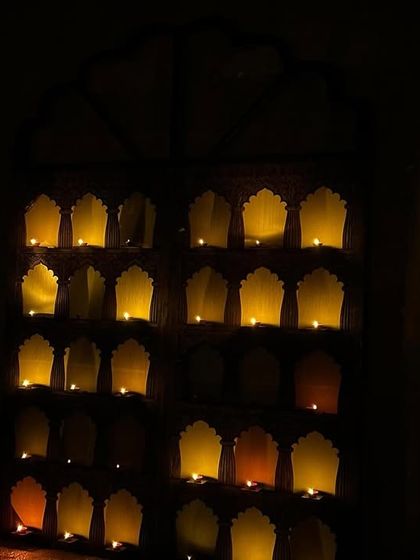 The night before the wedding, a sudden rainstorm lit up the water-based diyas we had laid out, creating this magical, unscripted moment that reminded us we weren't alone in this creation.