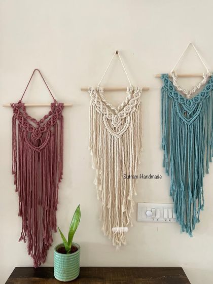 Here you can see three of my medium-sized wall hangings together. It shows how you can choose different colors for the same design, like this one in dusty rose, off-white, and teal blue.