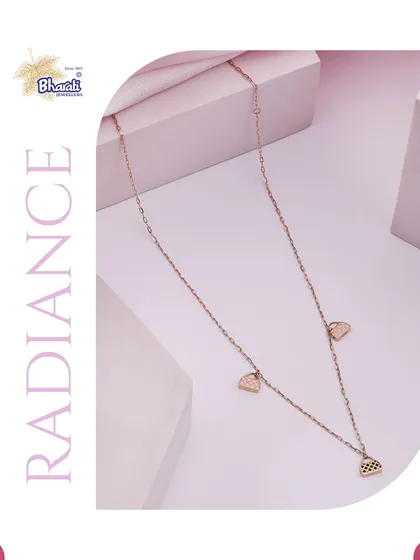 A delicate rose gold chain featuring small, fan-shaped charms, embodying radiance and grace.