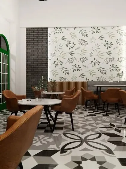 A perspective from a corner of the cafe, showing how the arched green windows add a pop of color and character. Every seating area is designed to feel a little different, giving customers a unique experience with each visit.