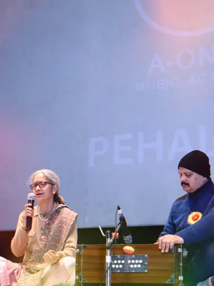 A student delivering a soulful Indian classical vocal performance, accompanied by the harmonium, at our 'Pehal' event. My classes are open to all ages, celebrating a lifelong passion for music.