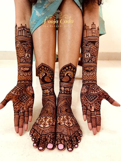 A full bridal mehendi set for an NRI bride from the US, with intricate peacock and skyline designs on both hands and feet.