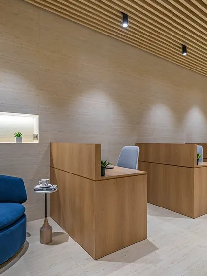This is the main workstation area from 'The Terra Office'. I focused on creating a warm, uncluttered, and productive environment using natural wood tones, a fluted ceiling for texture, and clean, modern lines.